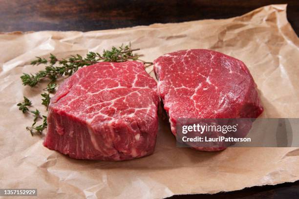 raw prime grade beef fillet mignon steaks - filet mignon stock pictures, royalty-free photos & images