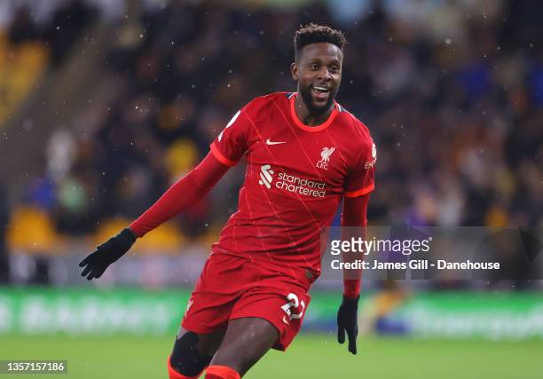 Divock Origi of Liverpool celebrates after scoring the winning goal during the Premier League match between Wolverhampton Wanderers and Liverpool at...