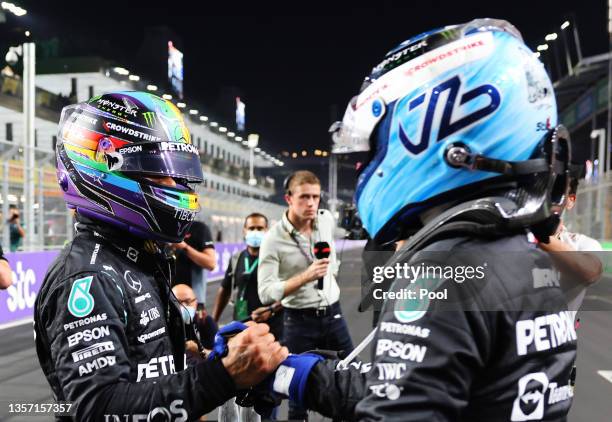 Pole position qualifier Lewis Hamilton of Great Britain and Mercedes GP and second place qualifier Valtteri Bottas of Finland and Mercedes GP...