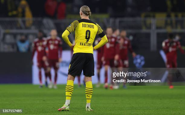 Erling Haaland of Dortmund looks on as the players of Muechen celebrate the second goal during the Bundesliga match between Borussia Dortmund and FC...