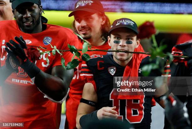 Wide receiver Britain Covey of the Utah Utes holds a rose in his teeth as he celebrates the team's 38-10 victory over the Oregon Ducks to win the...