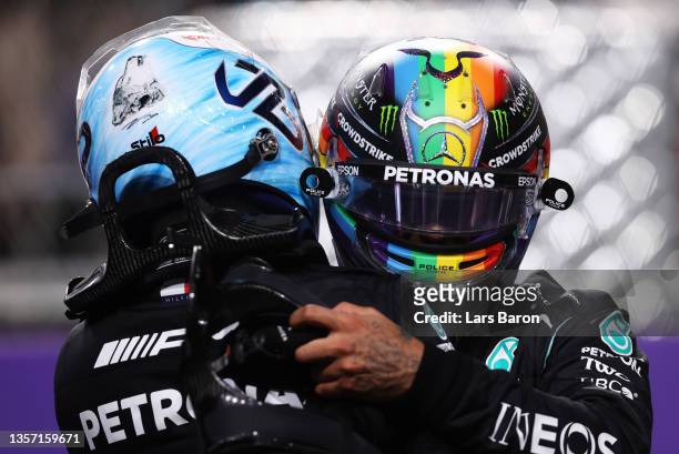 Pole position qualifier Lewis Hamilton of Great Britain and Mercedes GP and second place qualifier Valtteri Bottas of Finland and Mercedes GP...