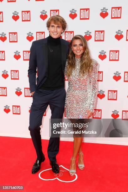 Sophia Thomalla and Alexander Zverev arrive for the "Ein Herz Für Kinder" Gala at Studio Berlin Adlershof on December 04, 2021 in Berlin, Germany.