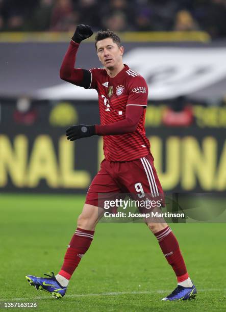 Robert Lewandowski of Muenchen celebrates scoring his team's third goal during the Bundesliga match between Borussia Dortmund and FC Bayern München...