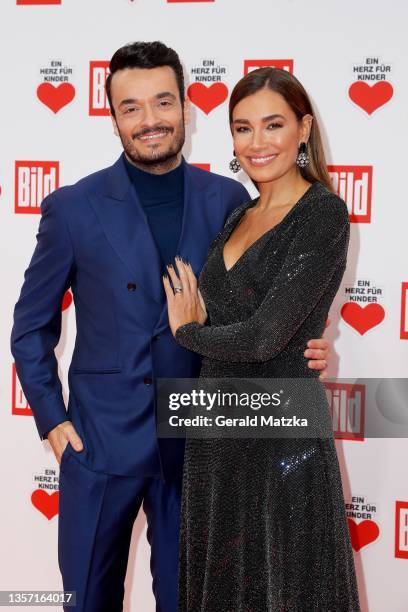 Giovanni Zarrella and Jana Ina Zarrella arrive for the "Ein Herz Für Kinder" Gala at Studio Berlin Adlershof on December 04, 2021 in Berlin, Germany.