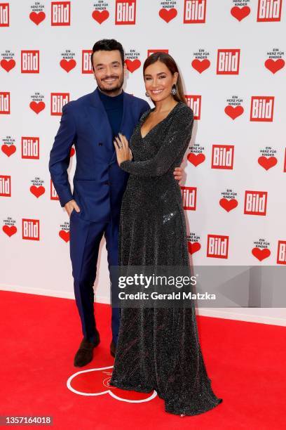 Giovanni Zarrella and Jana Ina Zarrella arrive for the "Ein Herz Für Kinder" Gala at Studio Berlin Adlershof on December 04, 2021 in Berlin, Germany.