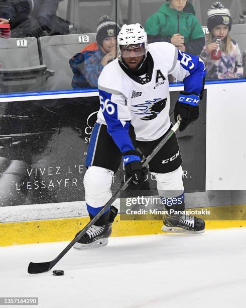 Christopher Inniss of the Saint John Sea Dogs looks to play the puck against the Blainville-Boisbriand Armada during the first period at Centre...