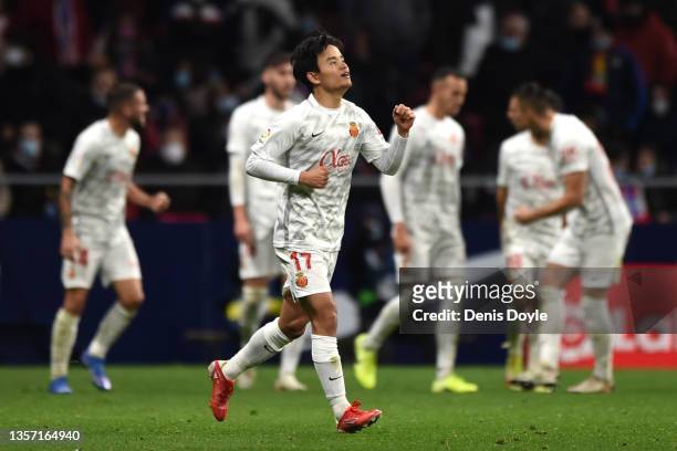 Takefusa Kubo of RCD Mallorca celebrates after scoring their side's second goal during the La Liga Santander match between Club Atletico de Madrid...