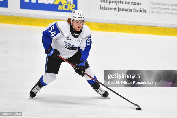 Jeremie Poirier of the Saint John Sea Dogs skates the puck against the Blainville-Boisbriand Armada during the second period at Centre d'Excellence...