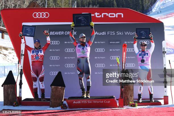 Matthias Mayer of Team Austria in second place, Aleksander Aamodt Kilde of Team Norway in first place and Beat Feuz of Team Switzerland in third...