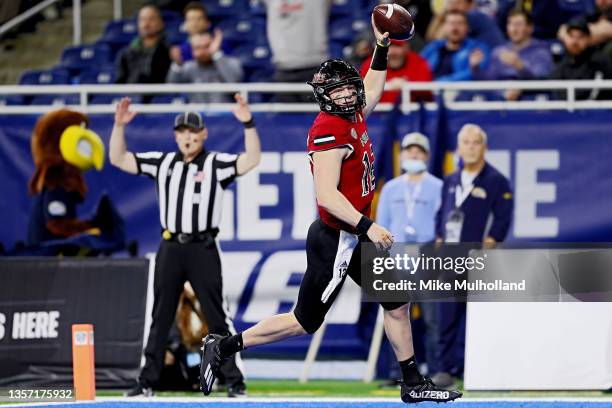 Rocky Lombardi of the Northern Illinois Huskies runs in for a touchdown in the second half against the Kent State Golden Flashes at Ford Field on...