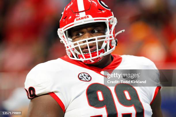 Jordan Davis of the Georgia Bulldogs looks on before the SEC Championship game against the Alabama Crimson Tide at Mercedes-Benz Stadium on December...