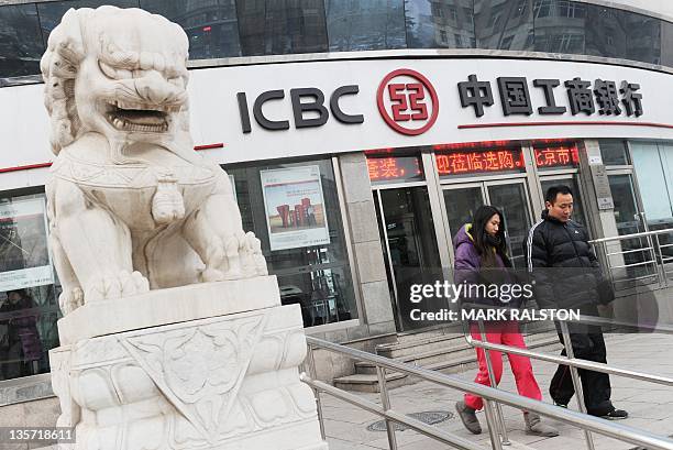 Customers leave an ICBC branch, after the bank came in second place on a list of the 50 most valuable Chinese brands realeased in Beijing on December...