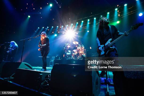 Dean White, Justin Sullivan and Ceri Monger of New Model Army perform at The Roundhouse on December 04, 2021 in London, England.