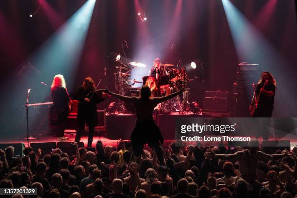 Dean White, Ed Aleyne-Johnson, Justin Sullivan, Michael Dean and Ceri Monger of New Model Army perform at The Roundhouse on December 04, 2021 in...