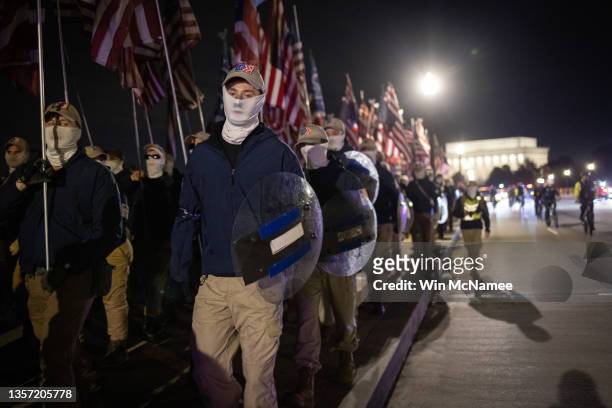 Members of the right-wing group Patriot Front march across Memorial Bridge in front of the Lincoln Memorial on December 04, 2021 in Washington, DC....