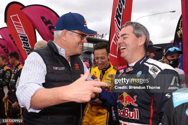 Australian Prime Minister Scott Morrison speaks to Craig Lowndes driver of the Red Bull Ampol Racing Holden Commodore ZB before the Bathurst 1000...