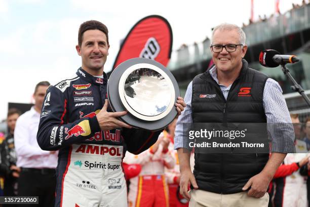 Jamie Whincup driver of the Red Bull Ampol Racing Holden Commodore ZB poses with Australian Prime Minister Scott Morrison after being inducted into...