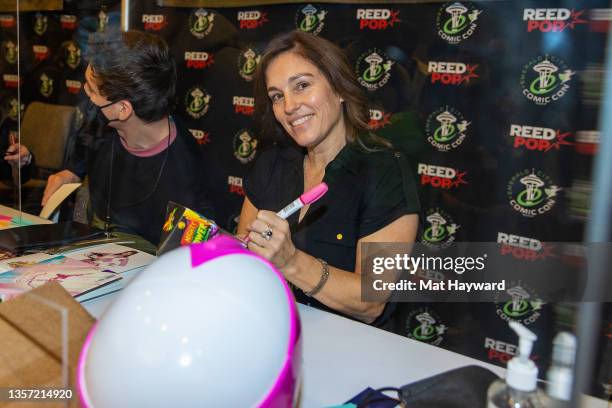 Actress Amy Jo Johnson signs an autograph during Emerald City Comic Con at the Sheraton Grand Hotel on December 04, 2021 in Seattle, Washington.