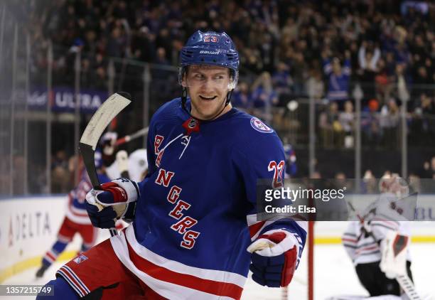 Adam Fox of the New York Rangers celebrates his goal in the second period against the Chicago Blackhawks at Madison Square Garden on December 04,...