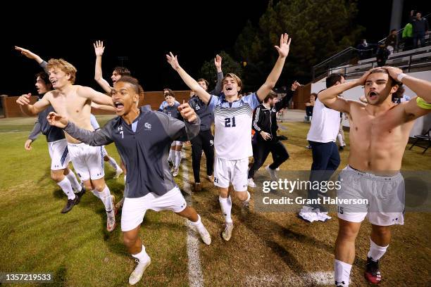 The Connecticut College Camels celebrate after the final penalty kick during their win against the Amherst Mammoths in the Division III Men’s Soccer...