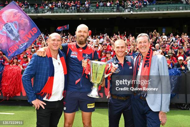 David Neitz, Max Gawn, Simon Goodwin and Neale Daniher pose with the trophy during the Melbourne Demons AFL Premiership Celebration at Melbourne...