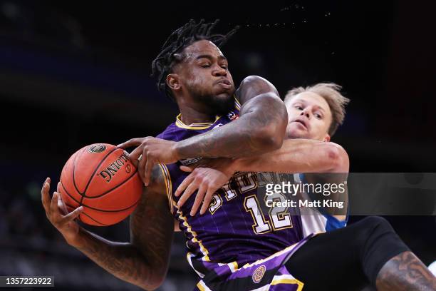 Jarell Martin of the Kings is challenged by Brad Newley of United during the round one NBL match between Sydney Kings and Melbourne United at Qudos...