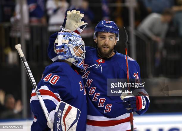 Alexandar Georgiev of the New York Rangers celebrates the win with teammate Barclay Goodrow after the game against the Chicago Blackhawks at Madison...