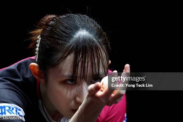 Hina Hayata of Japan serves against Cheng I-Ching of Chinese Taipei during their Women's Singles Round of 16 match on day two of the WTT Cup Finals...