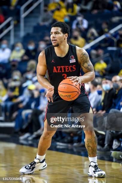 Matt Bradley of the San Diego State Aztecs handles the ball against the Michigan Wolverines during the first half at Crisler Arena on December 04,...