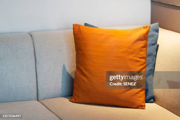 pillows and cushions on sofa - pillow foto e immagini stock