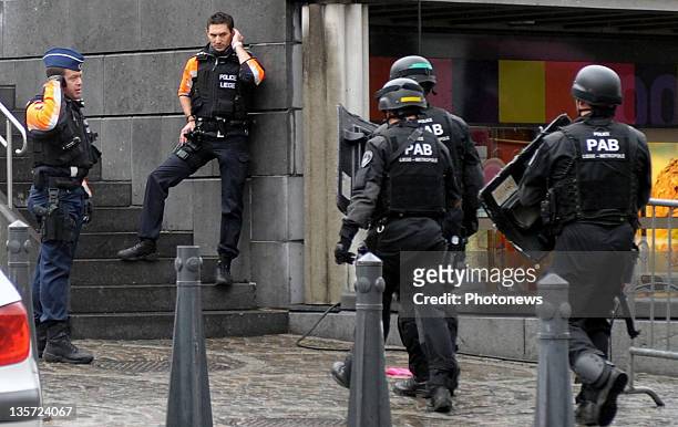 Armed police mobilise after a grenade attack at Place St-Lambert in the heart of the city on December 13, 2011 in Liege, Belgium. Two people were...