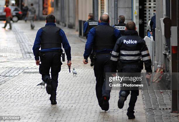 Armed police mobilise after a grenade attack at Place St-Lambert in the heart of the city on December 13, 2011 in Liege, Belgium. Two people were...