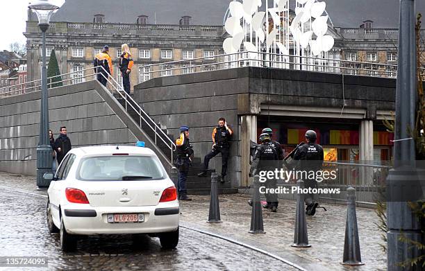 Armed police mobilise after a grenade attack at Place St-Lambert in the heart of the city on December 13, 2011 in Liege, Belgium. Two people were...