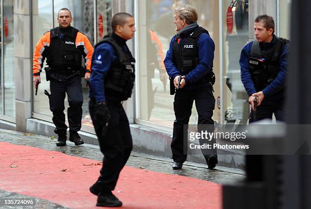 Armed police mobilise after a grenade attack at Place St-Lambert in the heart of the city on December 13, 2011 in Liege, Belgium. Two people were...