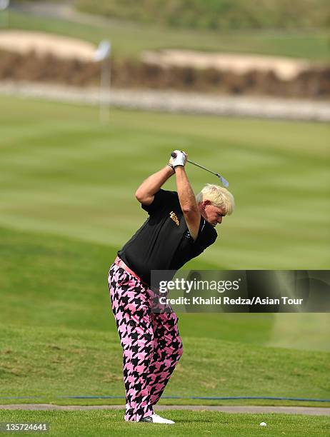 John Daly of USA plays a shot during his practice round of the Thailand Golf Championship at Amata Spring Country Club on December 13, 2011 in...
