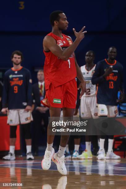 Victor Law of the Wildcats celebrates a 3 point shot during the round one NBL match between the Perth Wildcats and Cairns Taipans at RAC Arena on...