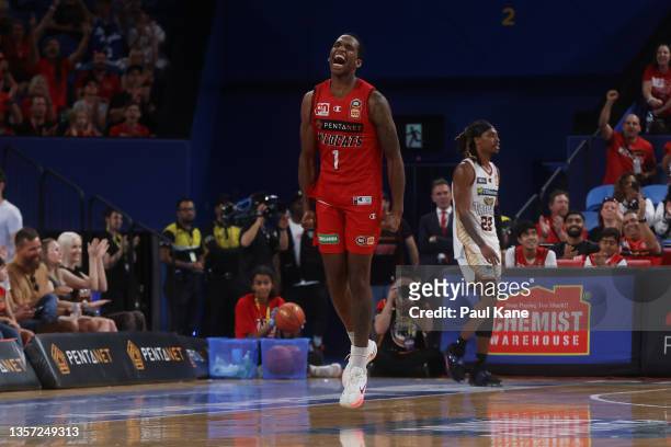 Victor Law of the Wildcats celebrates a 3 point shot during the round one NBL match between the Perth Wildcats and Cairns Taipans at RAC Arena on...