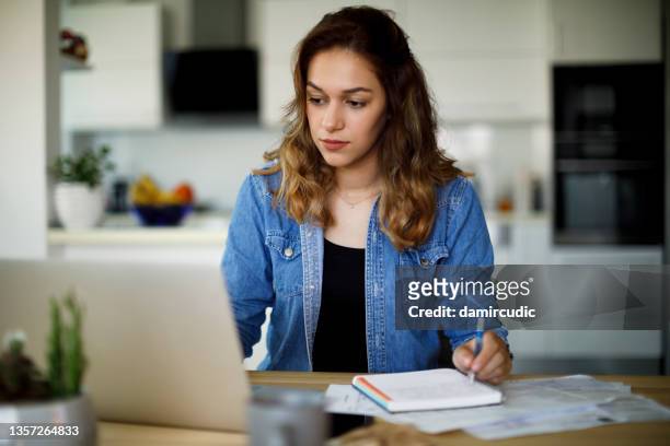 young woman working from home - multiple choice stock pictures, royalty-free photos & images