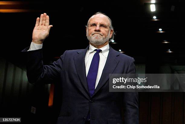 Former MF Global Chairman and CEO Jon Corzine is sworn in before testifying to the Senate Agriculture, Nutrition and Forestry Committee about the...