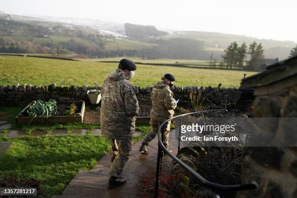 Craftsman Emily Heavisive and Trooper Josh Harvey from the Royal Lancers carry out a welfare check on a remote property that remains without power in...