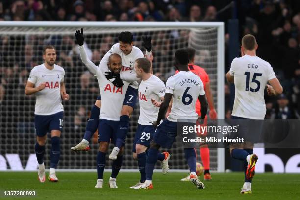 Lucas Moura of Tottenham Hotspur celebrates after scoring their sides first goal with team mate Heung-Min Son during the Premier League match between...