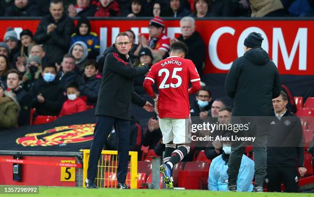 Jadon Sancho of Manchester United is substituted for Mason Greenwood of Manchester United as Ralf Rangnick, Manager of Manchester United looks on...