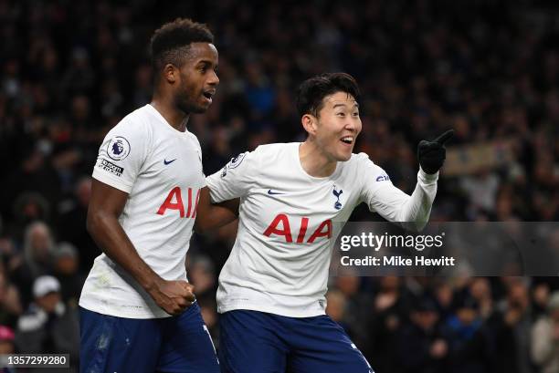 Heung-Min Son of Tottenham Hotspur celebrates after scoring their sides third goal with team mate Ryan Sessegnon during the Premier League match...