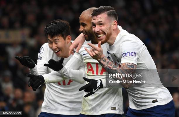 Heung-Min Son of Tottenham Hotspur celebrates after scoring their sides third goal with team mates Lucas Moura and Pierre-Emile Hojbjerg during the...