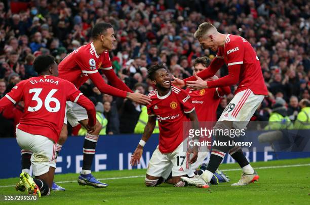 Fred of Manchester United celebrates with team mates after scoring their side's first goal during the Premier League match between Manchester United...
