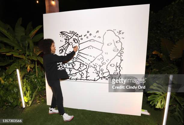 Shantell Martin creates on-site artwork during at the Mark Levinson Vinyl Lounge event at the Sacred Space during Art Basel Miami 2021. On December...