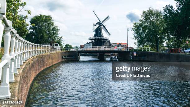windmill the adriaan in the historical center of haarlem city in the netherlands - haarlem stock pictures, royalty-free photos & images