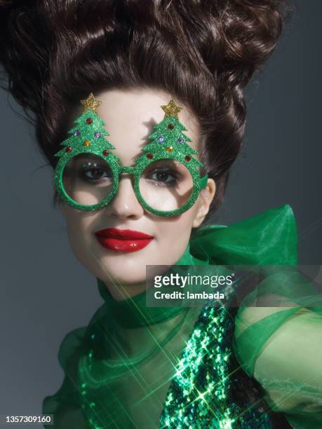 fashionable woman wearing funny christmas party glasses - crazy holiday models stock pictures, royalty-free photos & images