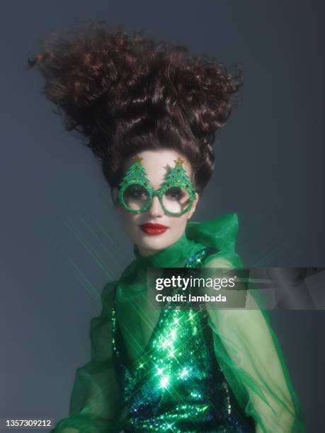 fashionable woman wearing funny christmas party glasses - crazy holiday models stock pictures, royalty-free photos & images